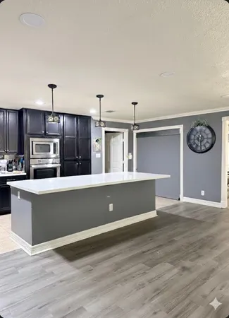 a dining room with furniture and a rug