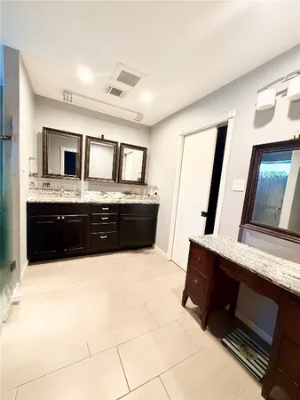 a room with lots of white furniture and window