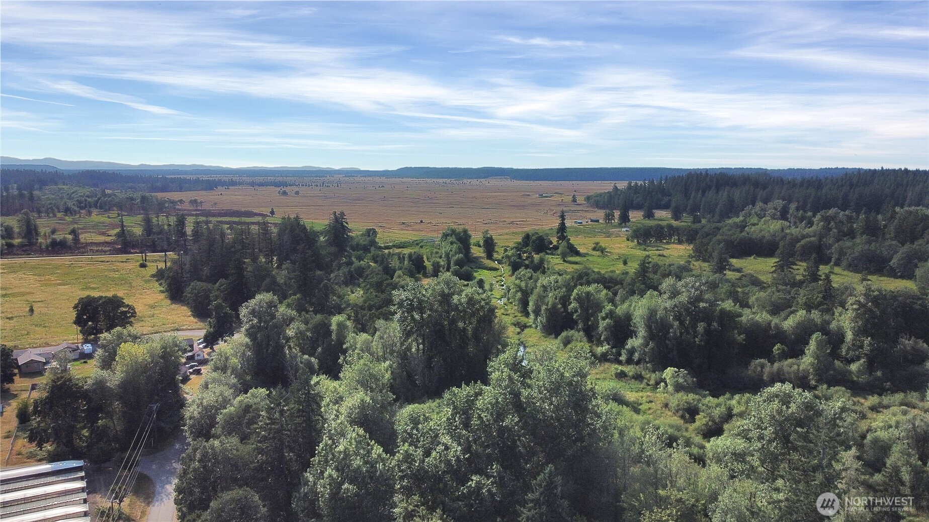 514 Higgins Greig Road South Roy, WA 98580 - Photo 16 of 19 a view of a lake with houses in back