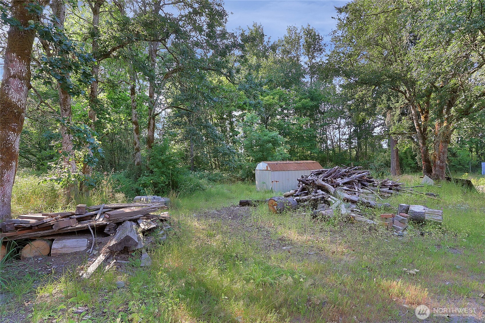 514 Higgins Greig Road South Roy, WA 98580 - Photo 18 of 19 a backyard of a house with table and chairs
