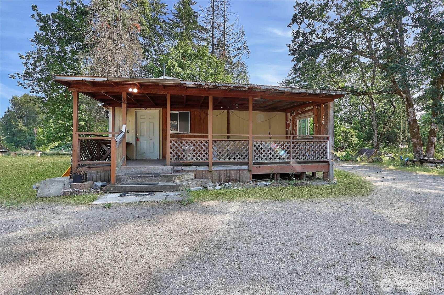 514 Higgins Greig Road South Roy, WA 98580 - Photo 2 of 19 a front view of a house with garden