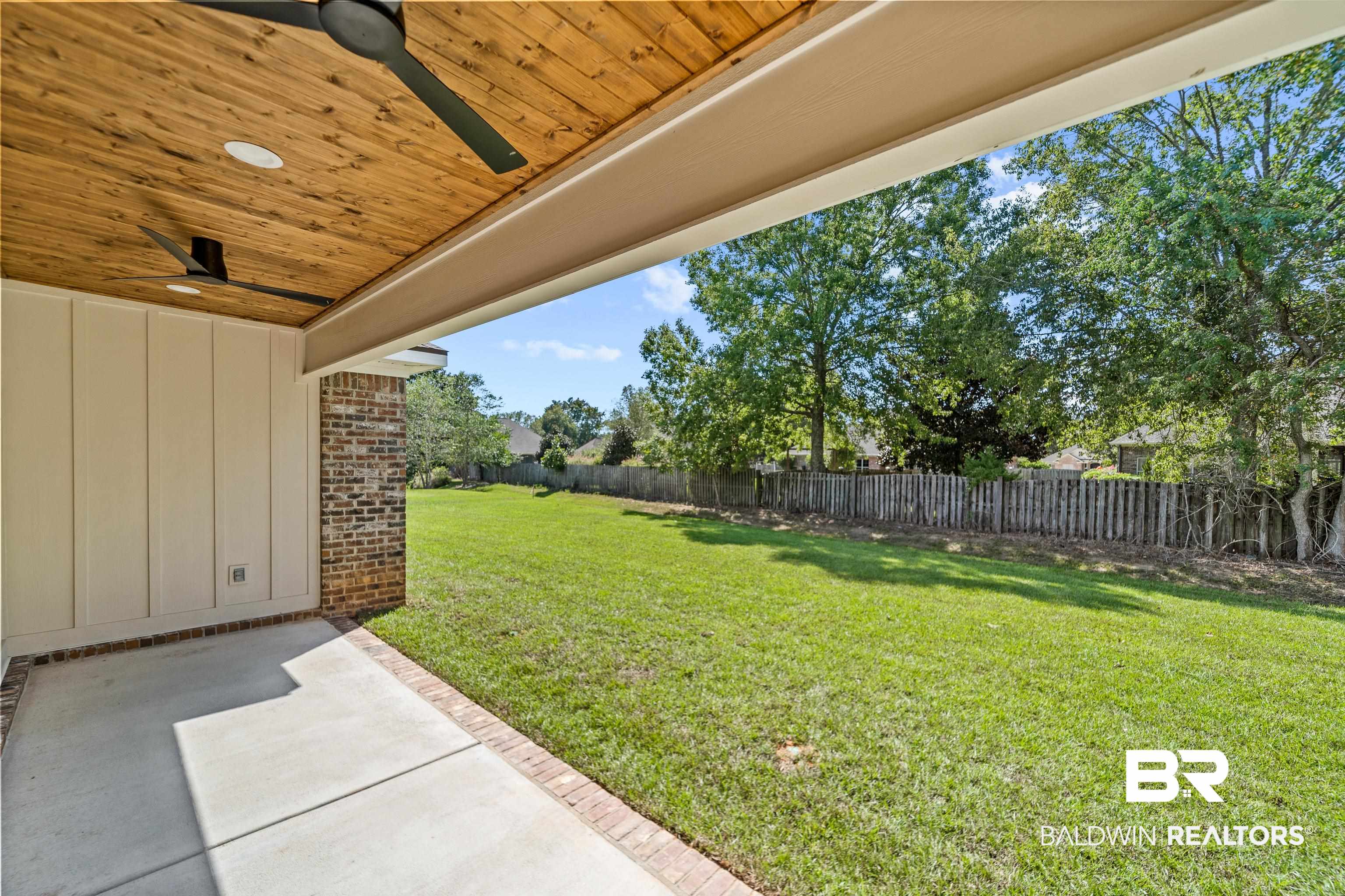 25927 Capra Court Daphne, AL 36526 - Photo 29 of 37 View of yard with ceiling fan and a patio