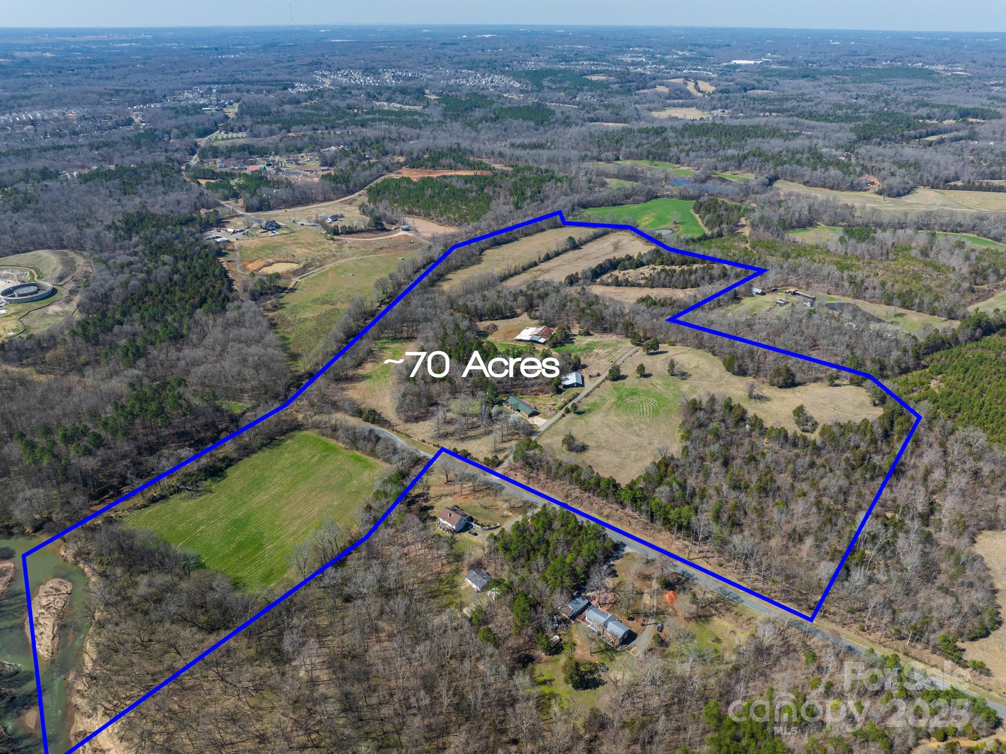 2555 Biggers Road Concord, NC 28025 - Photo 2 of 6 an aerial view of a tennis ground and a large park