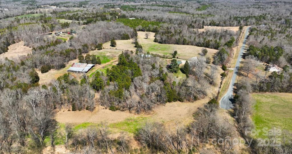 2555 Biggers Road Concord, NC 28025 - Photo 3 of 6 a view of a yard covered with snow