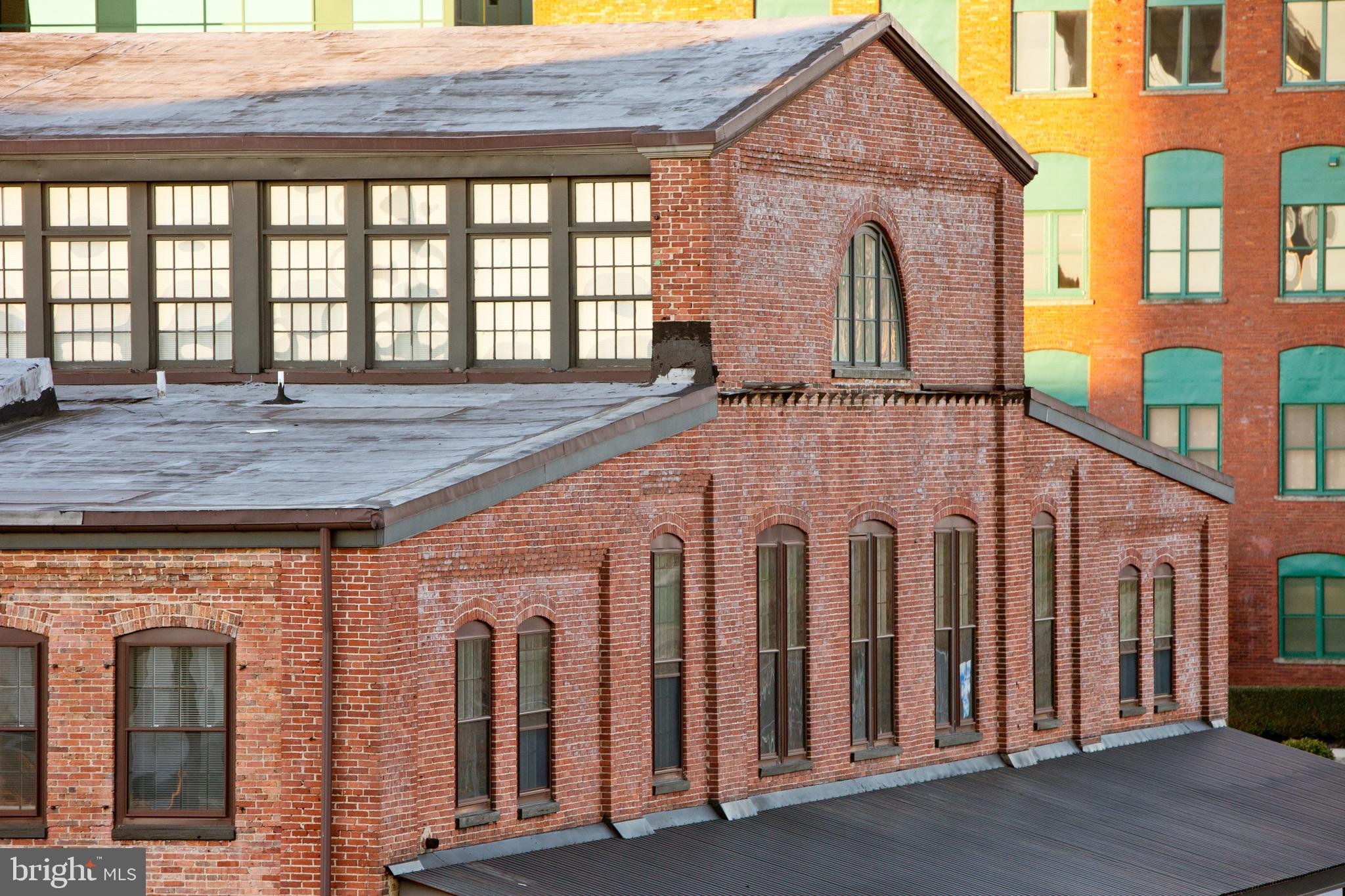 101 Wells Baltimore Md 21230, Unit 1BR Baltimore, MD 21230 - Photo 1 of 46 a front view of a house with large windows