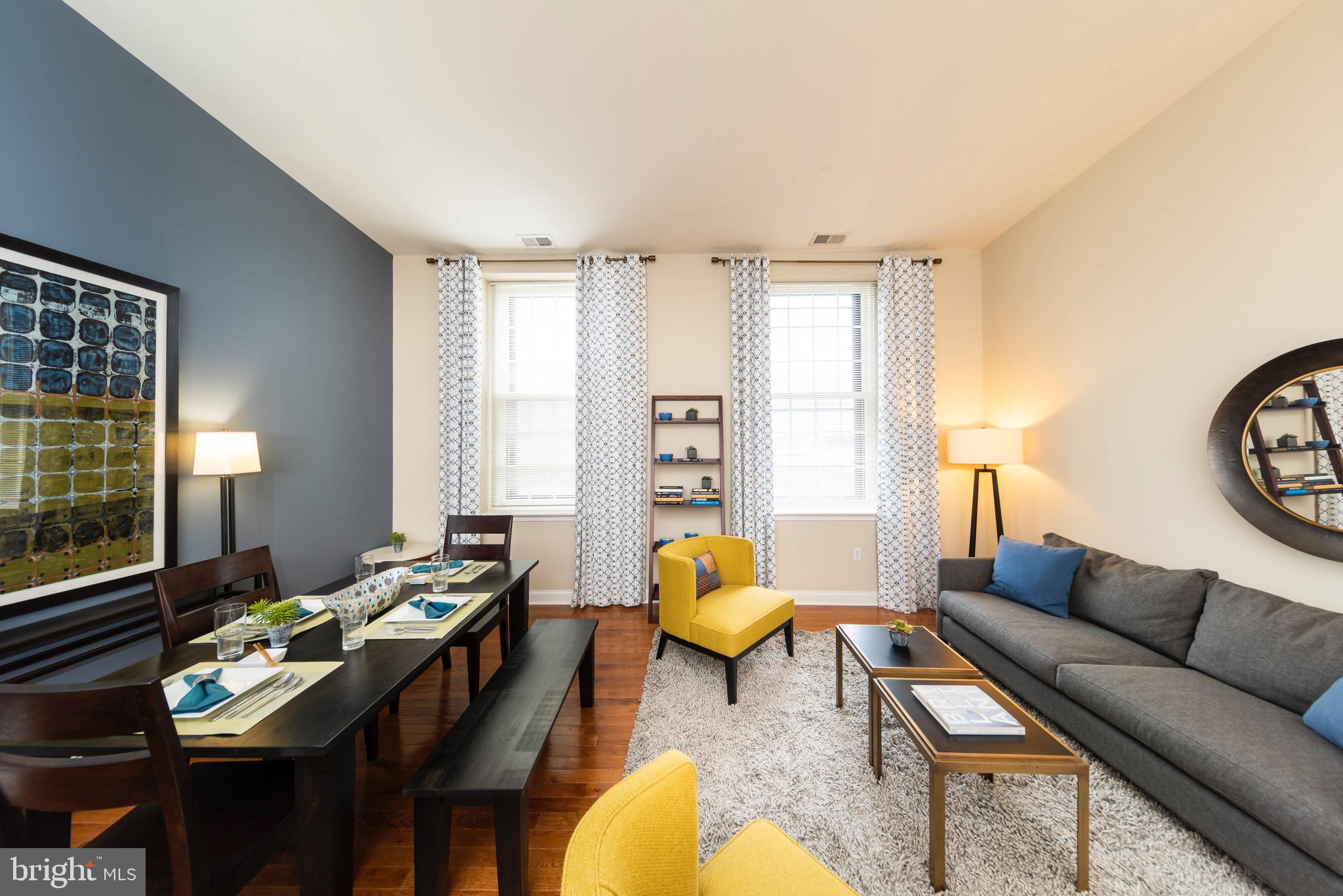 101 Wells Baltimore Md 21230, Unit 1BR Baltimore, MD 21230 - Photo 32 of 46 a living room with furniture and wooden floor