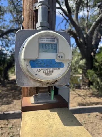 a view of a lake with beach and green space