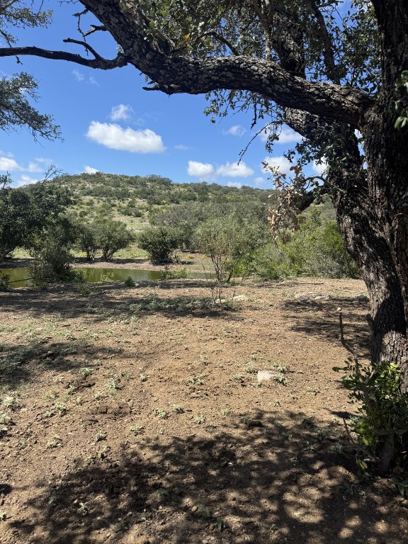 Lot 32 Private Road Rocksprings, TX 78880 - Photo 19 of 29 a view of a lake with beach and large trees