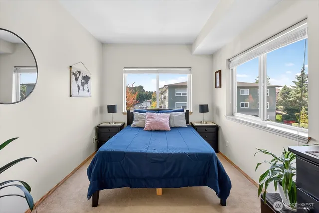 a bedroom with a bed and window