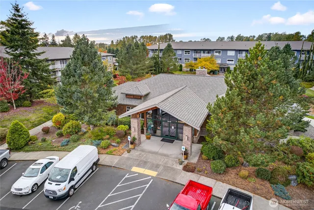 an aerial view of multiple houses with yard