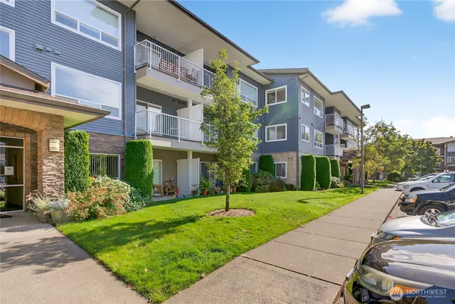 a front view of a building with garden
