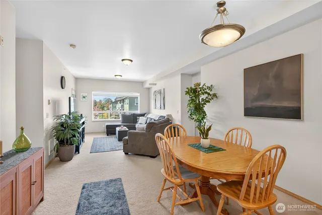 a living room with furniture potted plant and window