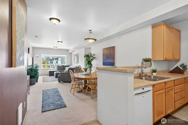 a living room with furniture and a dresser