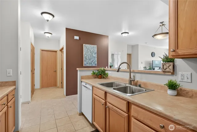 a kitchen with a sink and a refrigerator