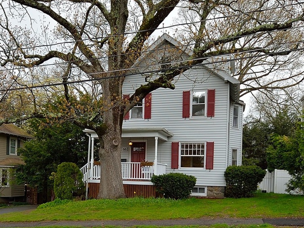 66 Hillcrest Road Needham, MA 02492 - Photo 1 of 28 a front view of a house with a yard and trees