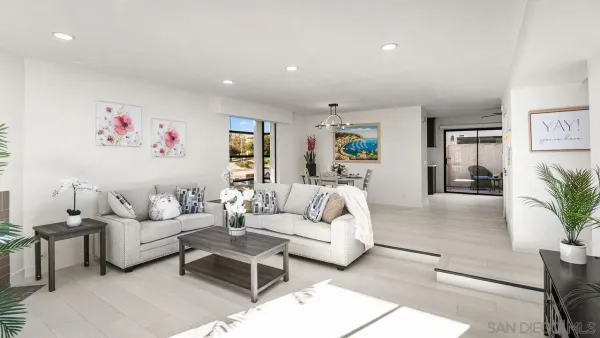 a living room with furniture and a painting