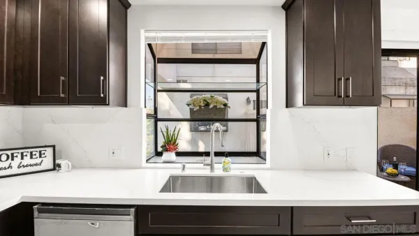 a kitchen with a sink and a window