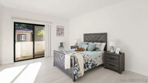 a bedroom with a bed and a cabinets