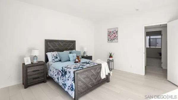 a bedroom with a bed and a cabinets