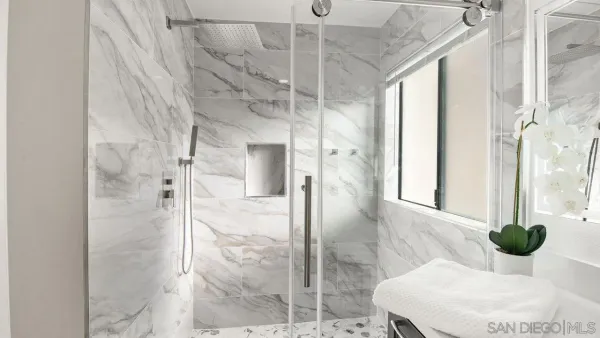 a bathroom with a tub and shower