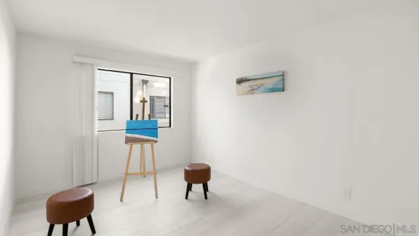 a hallway with a bench and a chair