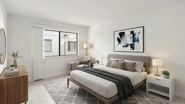 a bedroom with a bed and a window