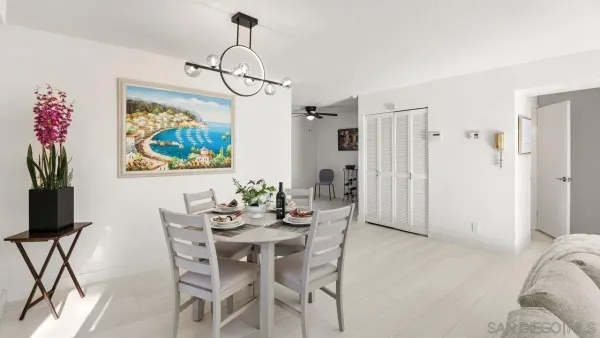 a dining room with furniture a livingroom and chandelier