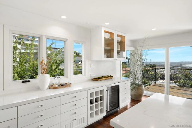 a spacious bedroom with a large bed and a large window