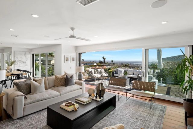 a living room with furniture and a table