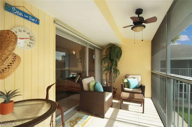 a front view of multiple houses with yard