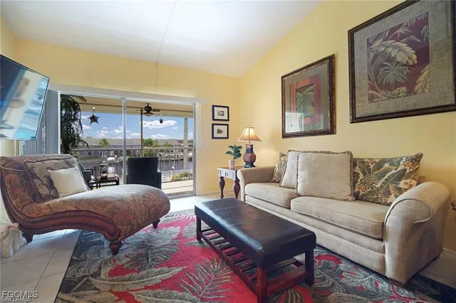 a bedroom with a bed and a television