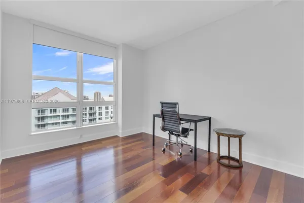 a view of a livingroom with furniture and wooden floor