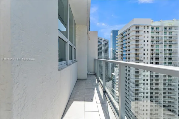 a view of balcony with wooden floor