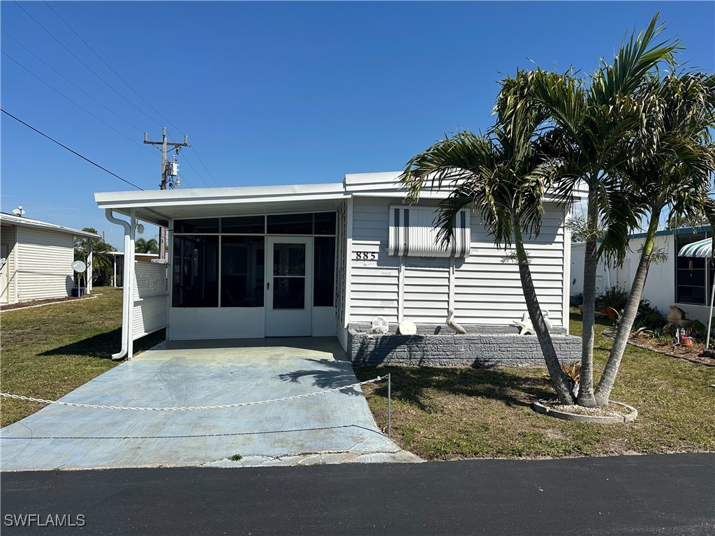 885 Homestead Drive North Fort Myers, FL 33917 - Photo 1 of 29 a view of a house with a patio