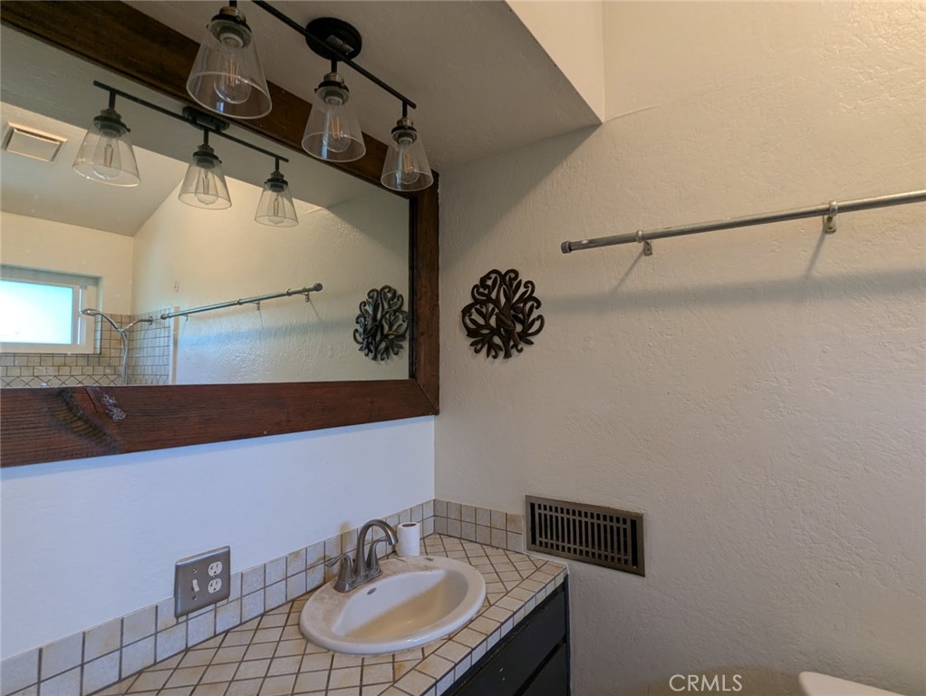 2382 Faber Street Durham, CA 95938 - Photo 13 of 20 a bathroom with a sink and a mirror