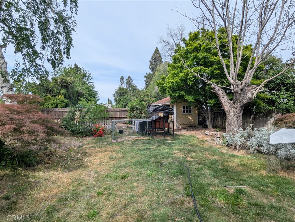 2382 Faber Street Durham, CA 95938 - Photo 19 of 20 a white house that has a tree in front of it
