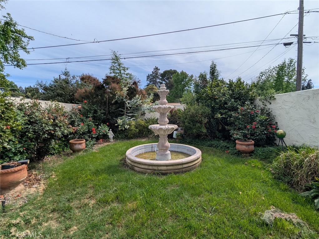 2382 Faber Street Durham, CA 95938 - Photo 5 of 20 a view of a backyard with plants and a garden