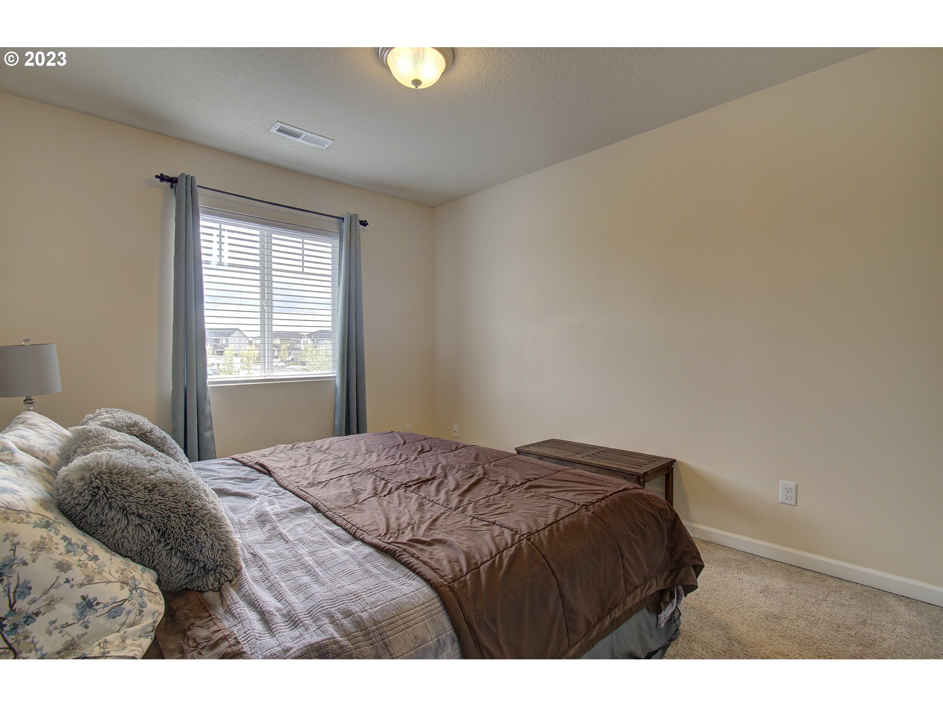 2726 South Red Tail Loop Ridgefield, WA 98642 - Photo 14 of 39 a bedroom with a bed and a window