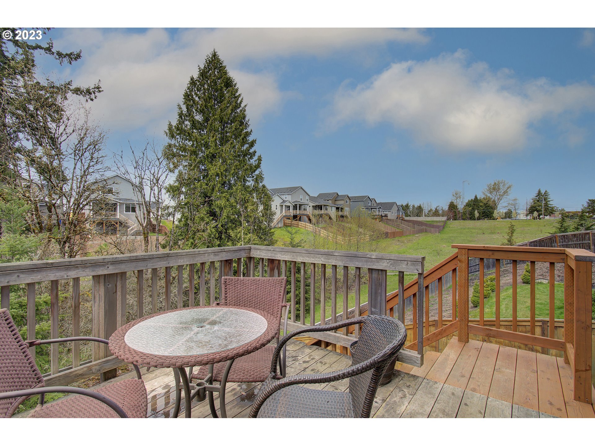 2726 South Red Tail Loop Ridgefield, WA 98642 - Photo 33 of 39 a view of a balcony with furniture and a garden