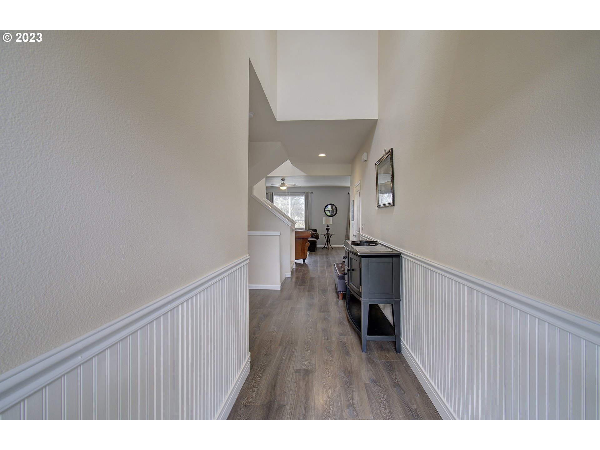 2726 South Red Tail Loop Ridgefield, WA 98642 - Photo 5 of 39 a view of a hallway with wooden floor and staircase