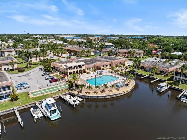an aerial view of a house with a ocean view