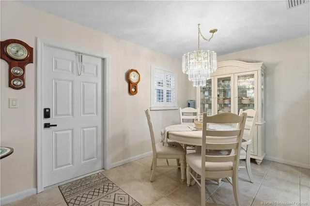 a view of a dining room with furniture and window