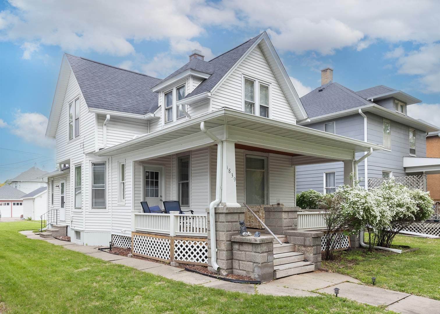 1839 15th Street Moline, IL 61265 - Photo 2 of 32 a front view of a house with a yard