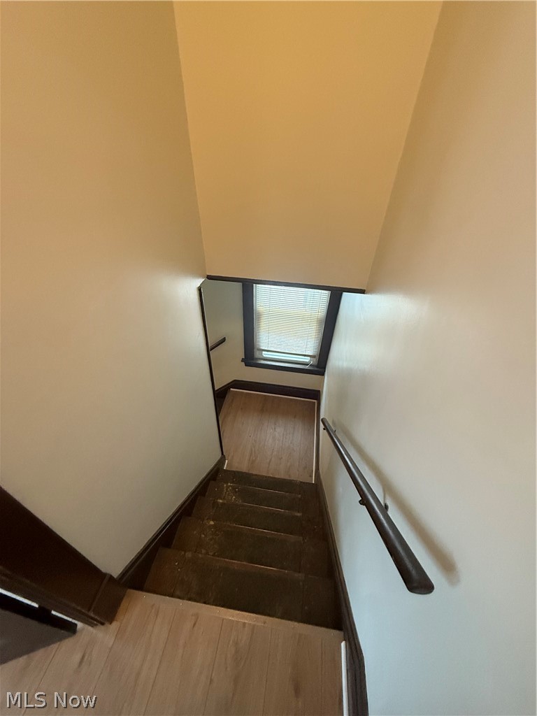 3612 Riverside Avenue Cleveland, OH 44109 - Photo 13 of 22 Stairwell featuring light-toned walls and dark trim
