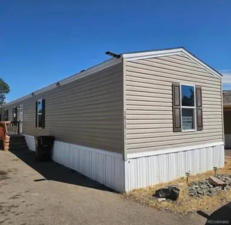 a front view of a house with a roof