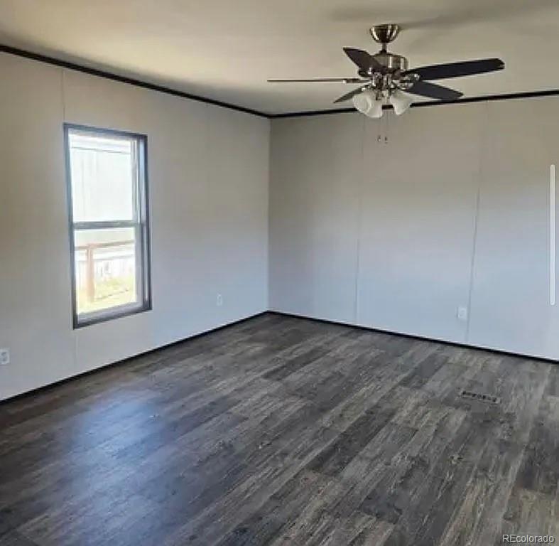 3630 E Street Evans, CO 80620 - Photo 5 of 7 wooden floor in an empty room with a window