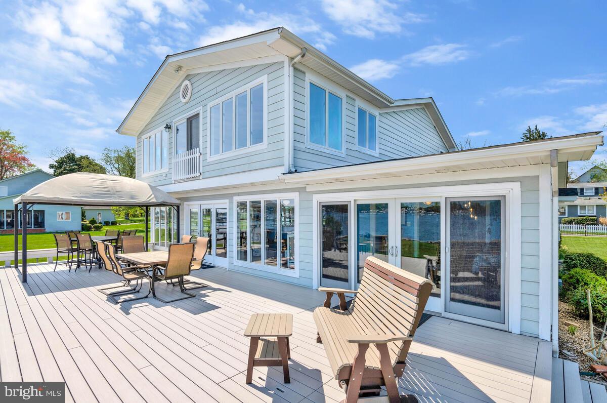 201 Edgewater Drive Edgewater, MD 21037 - Photo 14 of 49 a view of a house with a porch and furniture