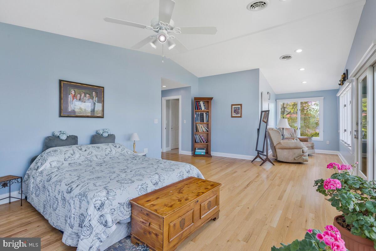 201 Edgewater Drive Edgewater, MD 21037 - Photo 22 of 49 a bed room with a bed couch and a window