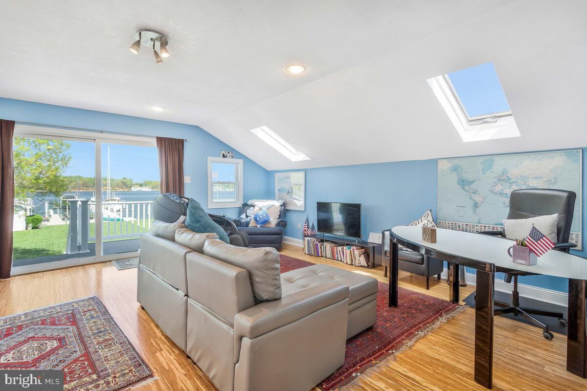 201 Edgewater Drive Edgewater, MD 21037 - Photo 30 of 49 a living room with furniture and a wooden floor