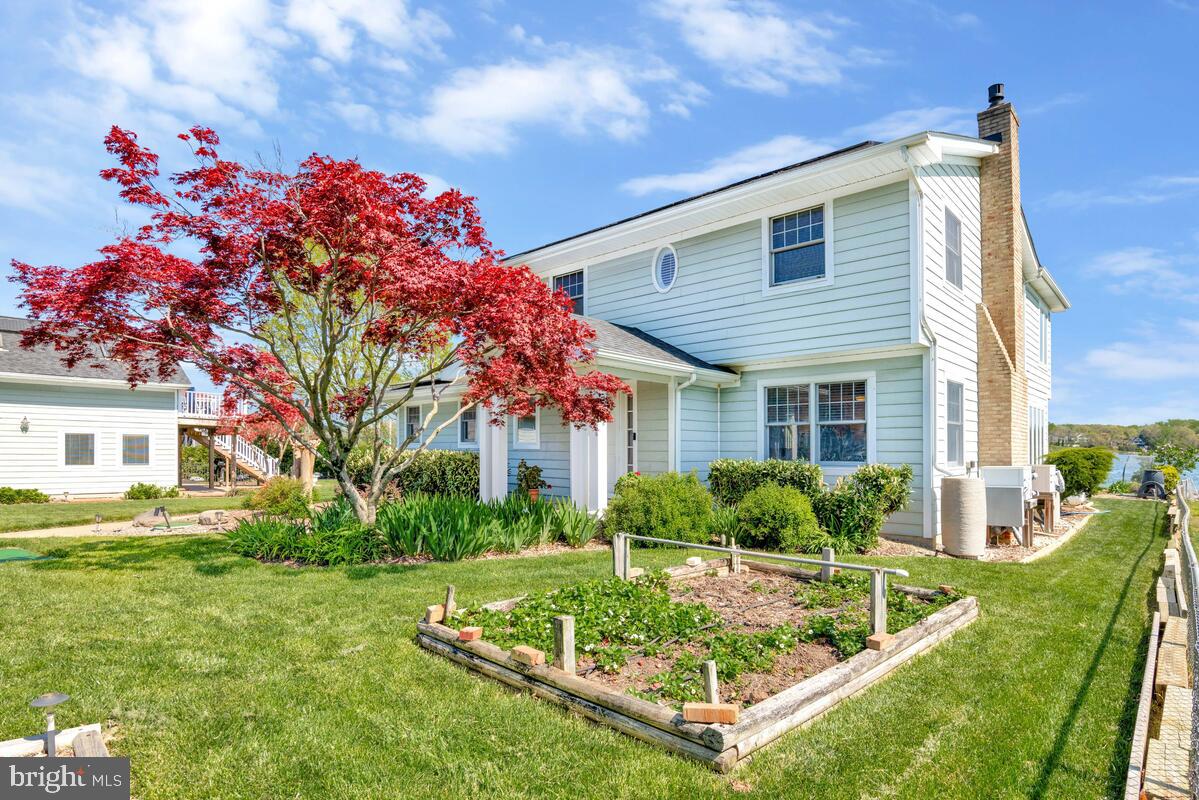 201 Edgewater Drive Edgewater, MD 21037 - Photo 34 of 49 a front view of a house with garden